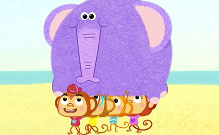 Four monkeys carrying a large purple elephant.